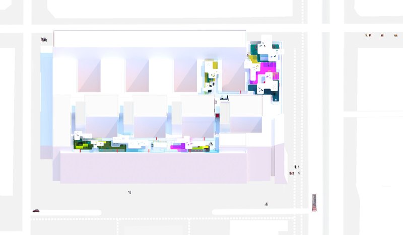 Site plan drawing showing the building footprint with colorful zones distributed across the rooftop and courtyard areas