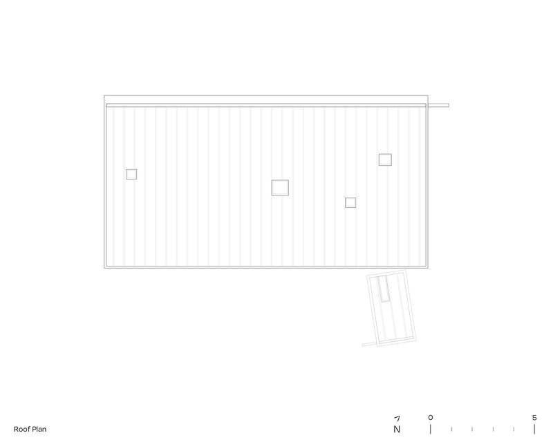 Roof plan drawing showing a sloped surface with four roof penetrations and an angled outbuilding