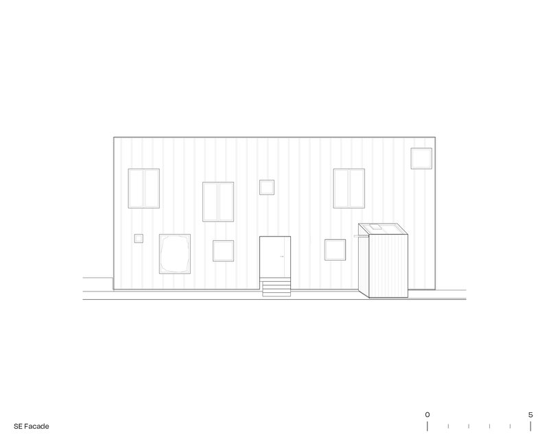 Elevation drawing of the southeast facade with varied window openings and a protruding volume on vertical cladding