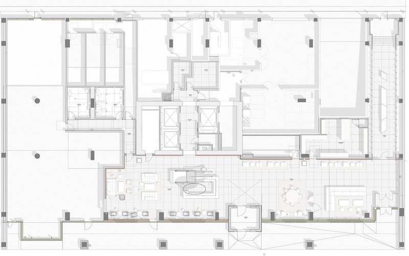 Floor plan drawing showing residential units arranged around a central core with double-height spaces