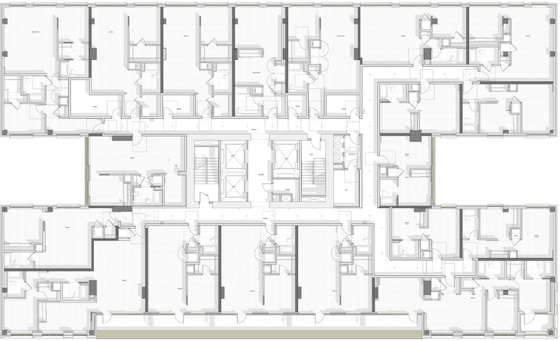 Floor plan drawing showing a typical residential level with repeating units and central elevator cores