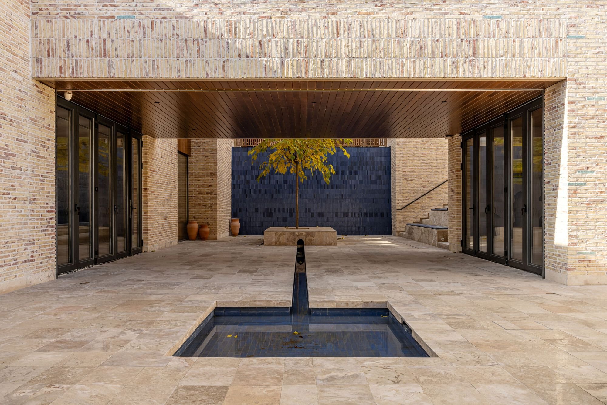 ARC Architects Wraps a Tashkent Textile Museum in Perforated Brick and Carved Timber Screens