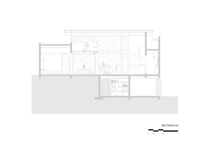 Section drawing showing a split-level residence with multiple rooms and a sunken lower level