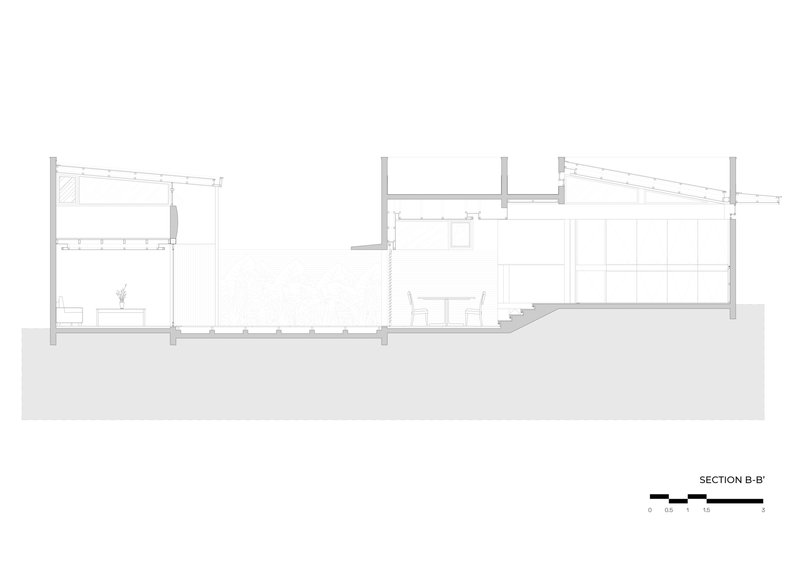 Section drawing depicting sloped roof planes and interior spaces on varying floor levels
