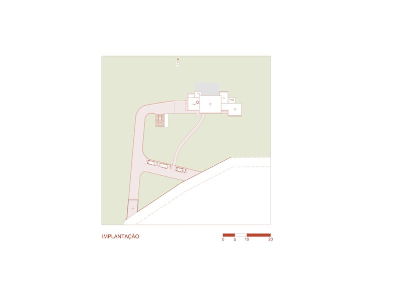 Site plan drawing showing the linear building placement and curving access drive across the sloped property