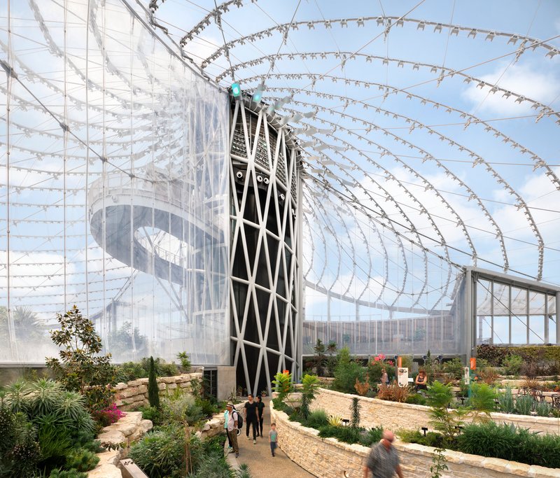 Diagonal-braced tower supporting the radiating cable net structure above terraced planted beds with visitors below