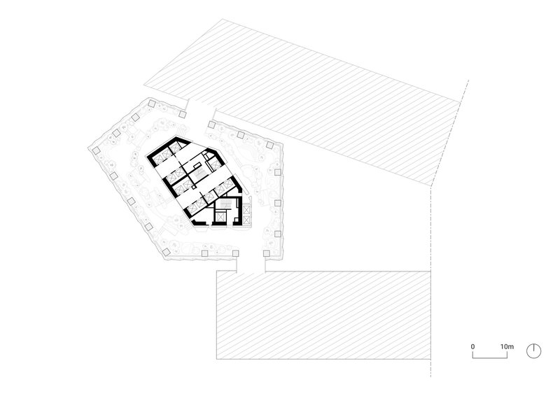 Floor plan showing pentagonal open area with central core and adjacent hatched volumes