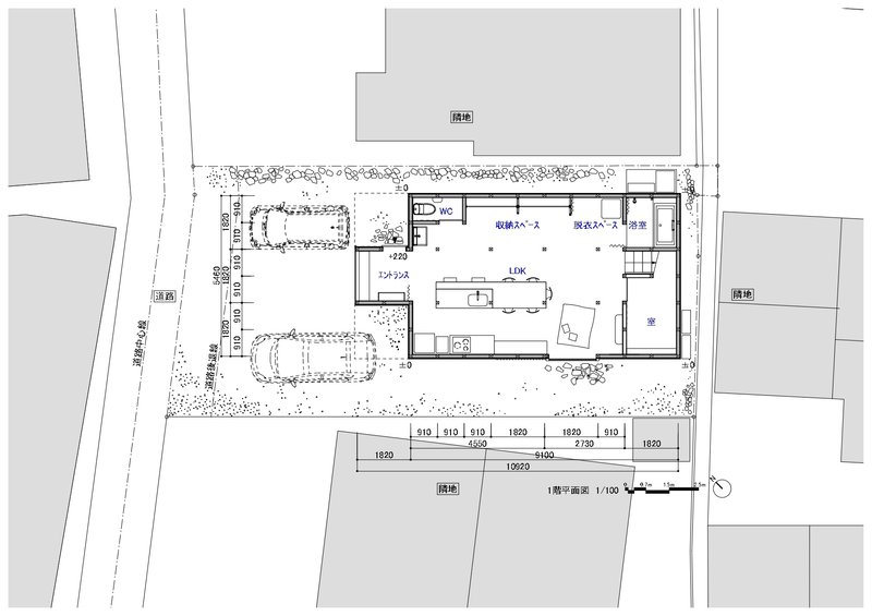 Ground floor plan drawing showing central living space with two parking bays and planted perimeter beds