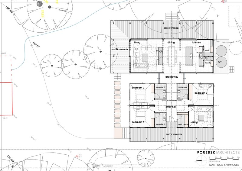 Floor plan drawing showing living wing and bedroom wing separated by central breezeway with surrounding landscape