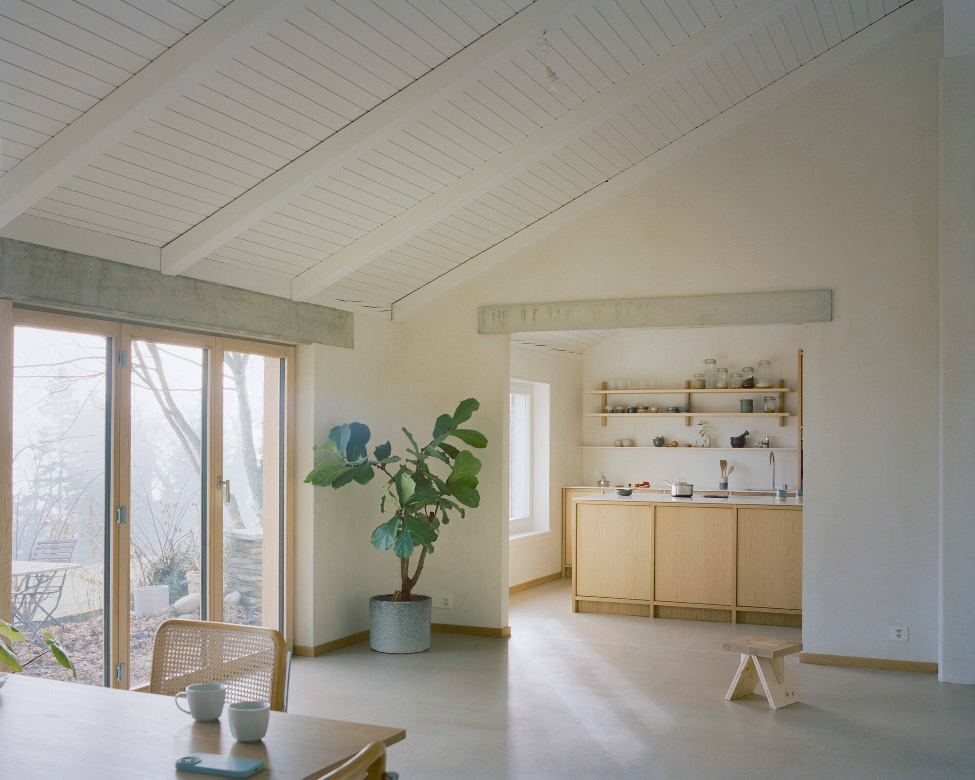 Noue Studio Refines a 1983 Swiss Villa by Swapping Rooms and Stripping Back to Structure