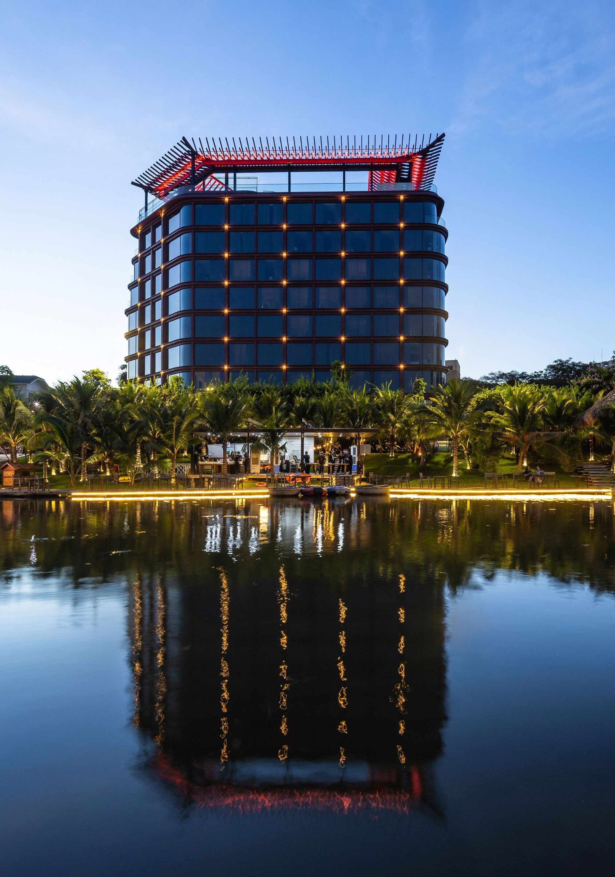Baumschlager Eberle Wraps a Hanoi Hotel in a Red Lattice Shell Inspired by Silk and Dynasty