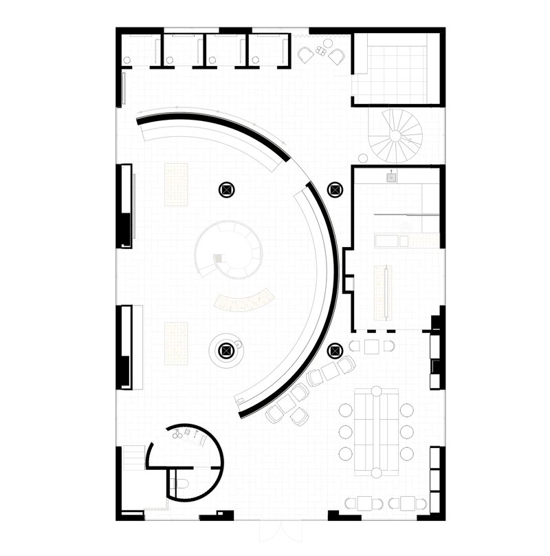 Floor plan drawing showing a curving wall enclosing a spiral stair and open workspace