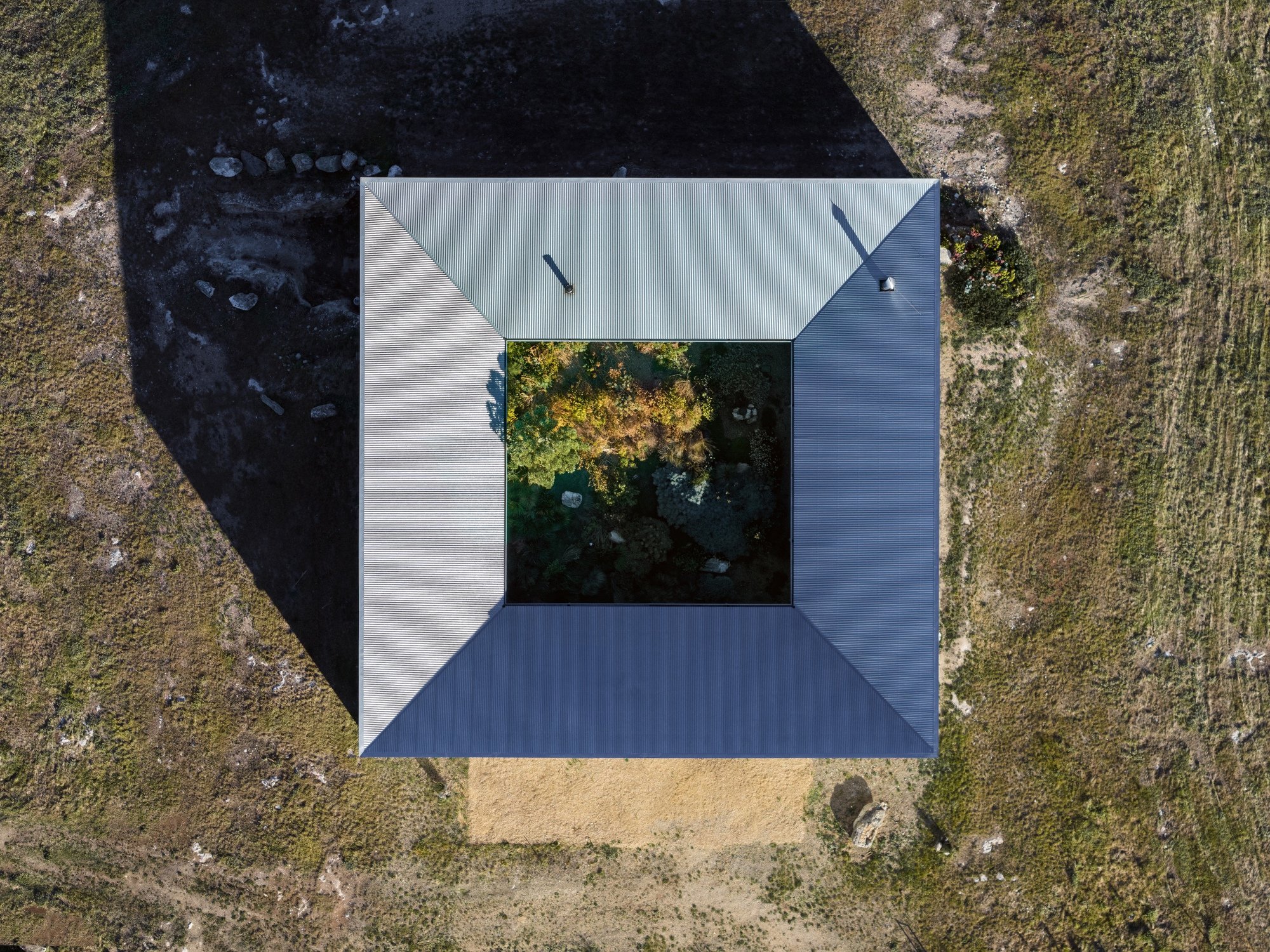 Architects Ink Turns an Australian Hilltop Shed Inside Out Around a Hidden Courtyard