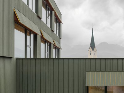 Pedevilla Architects Disguise a Five-Story School as a Tyrolean Farmhouse in Kössen