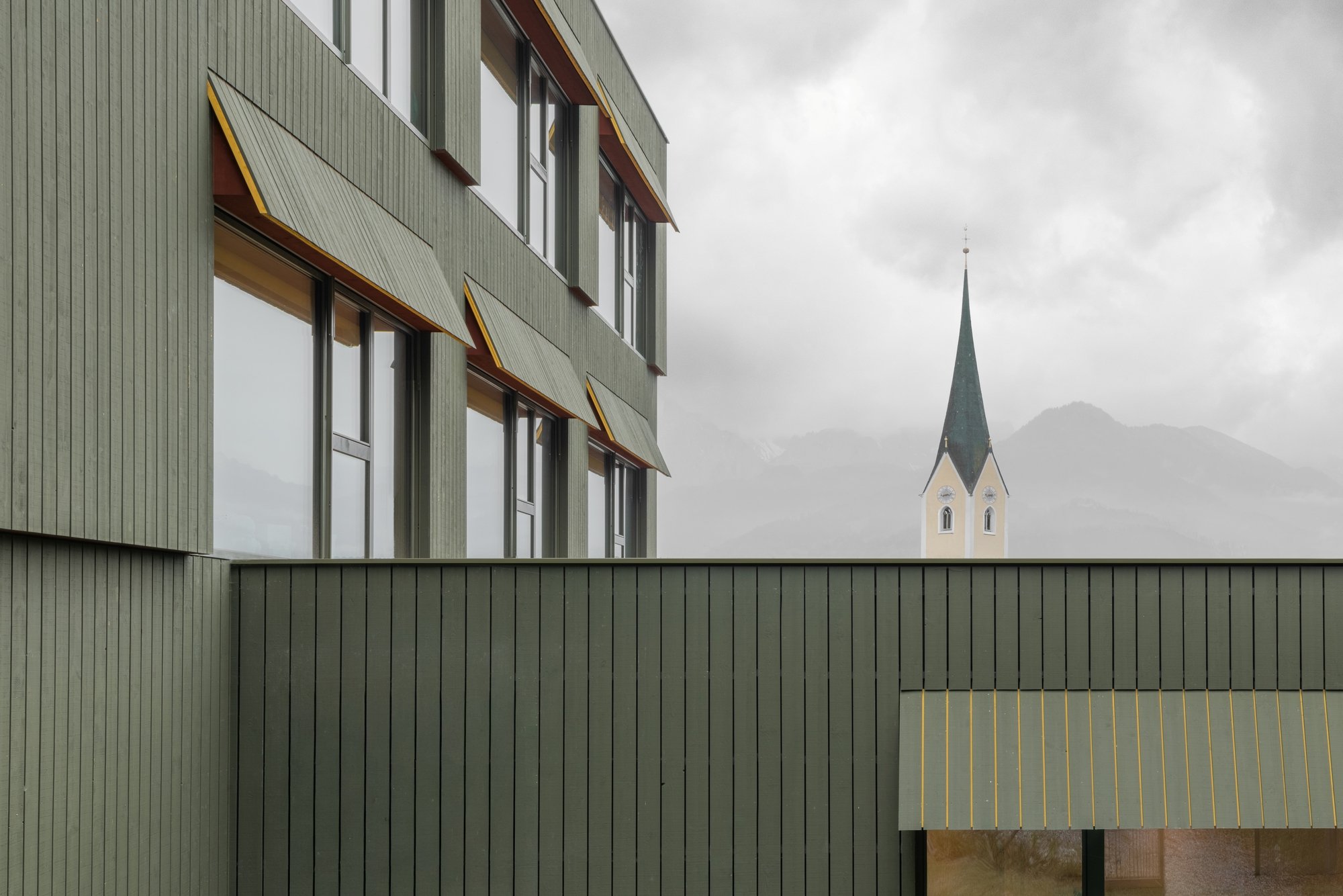 Pedevilla Architects Disguise a Five-Story School as a Tyrolean Farmhouse in Kössen