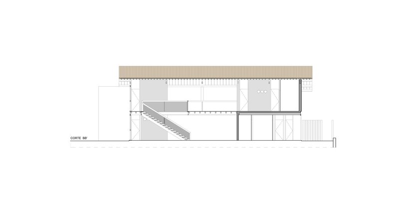 Section drawing showing a two-story residence with an interior staircase and flat roof overhang