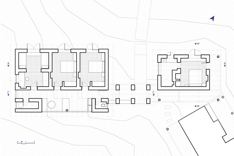 Floor plan drawing showing interconnected pavilions with thick walls and central courtyards