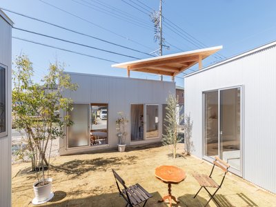 Hidekazu Kishi Builds His Own Family Home as a Cluster of Volumes Around a Sand Courtyard