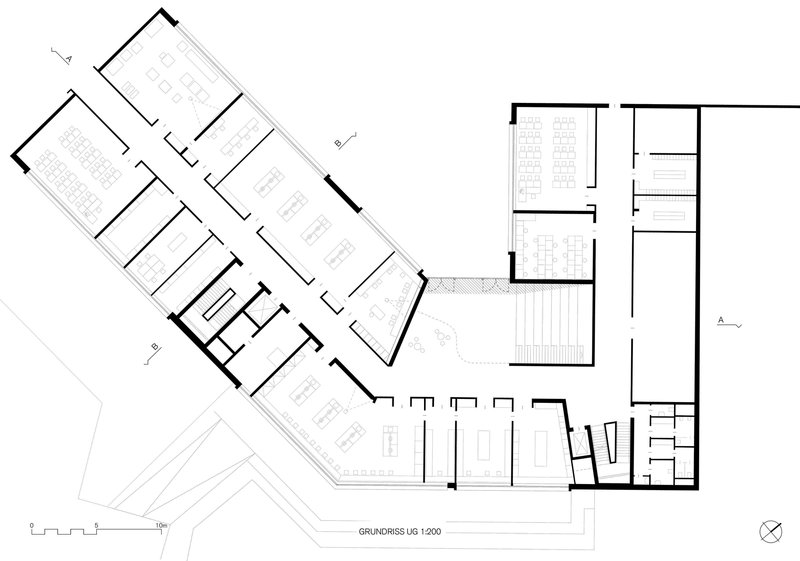 Ground floor plan drawing showing angled wings of rooms around a central staircase and pool