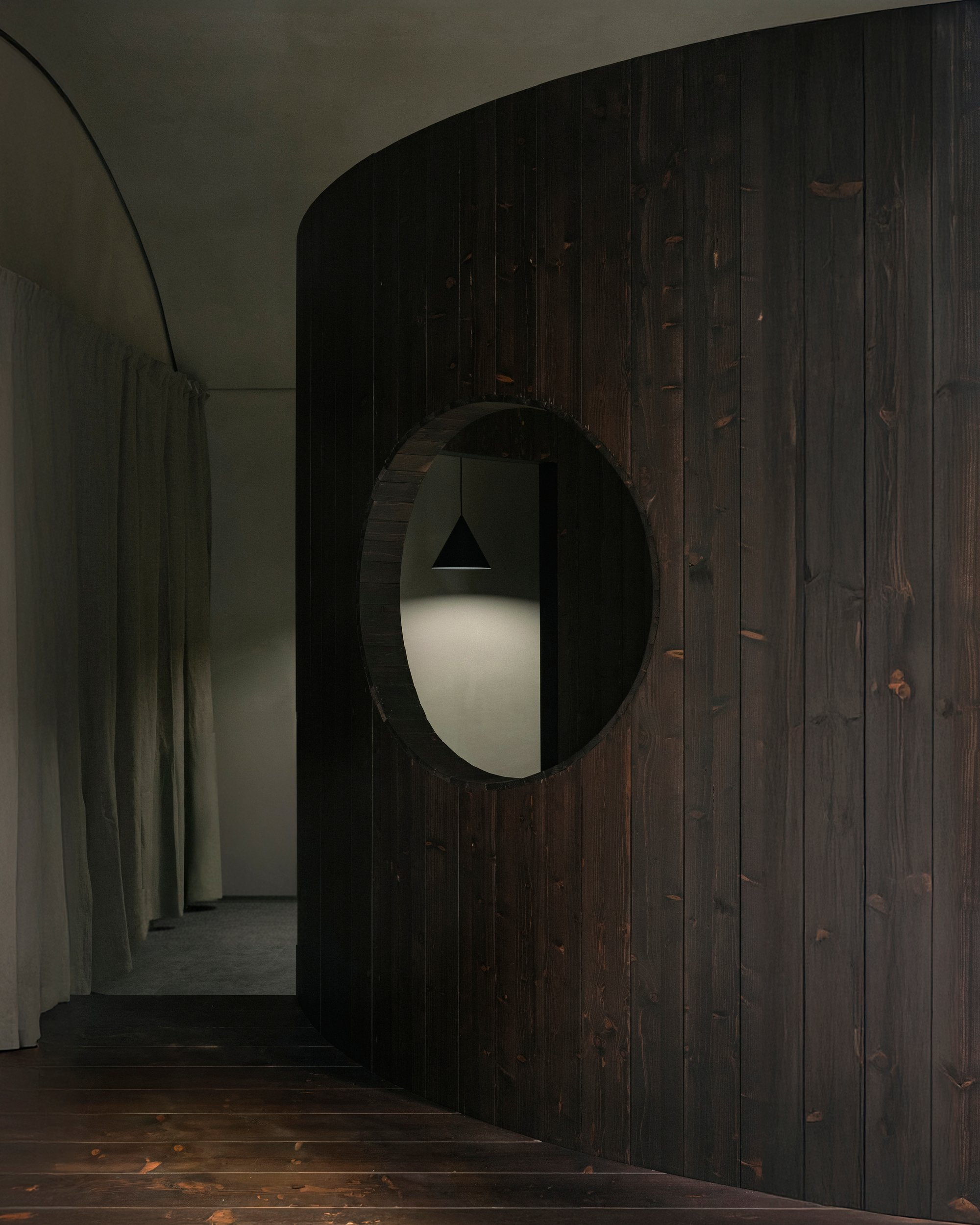 AACM Carves a 50-Square-Meter Ceramic Workshop from Curved Timber and Shadow in Milan