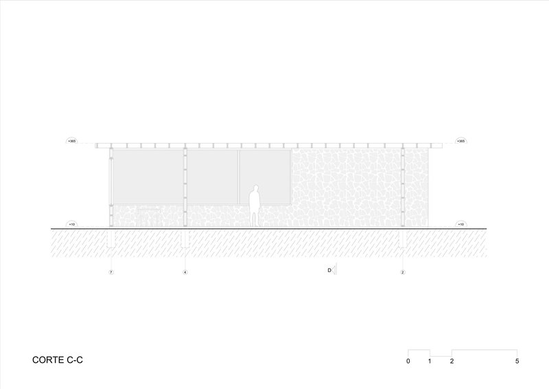 Section drawing displaying open interior space with textured wall panels and continuous roofline