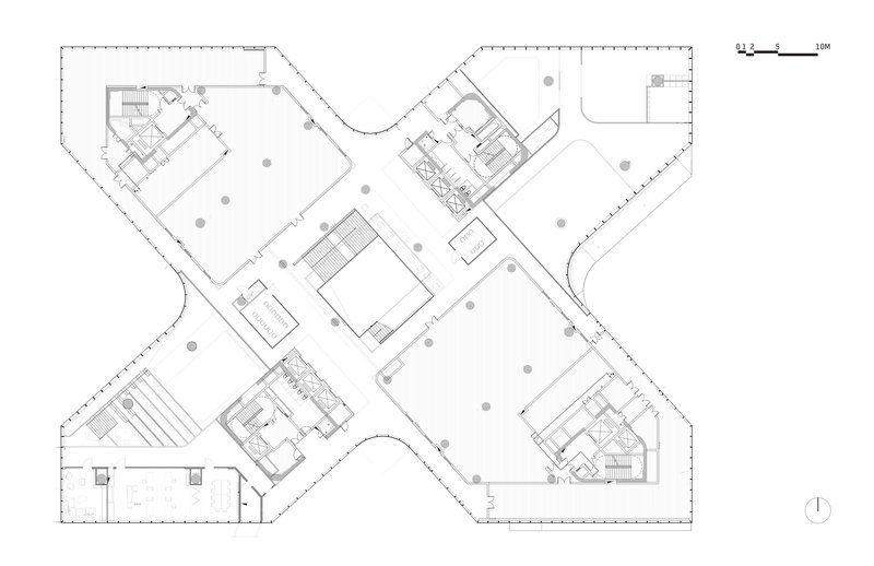 Floor plan drawing depicting four angular wings with central core and scattered structural columns