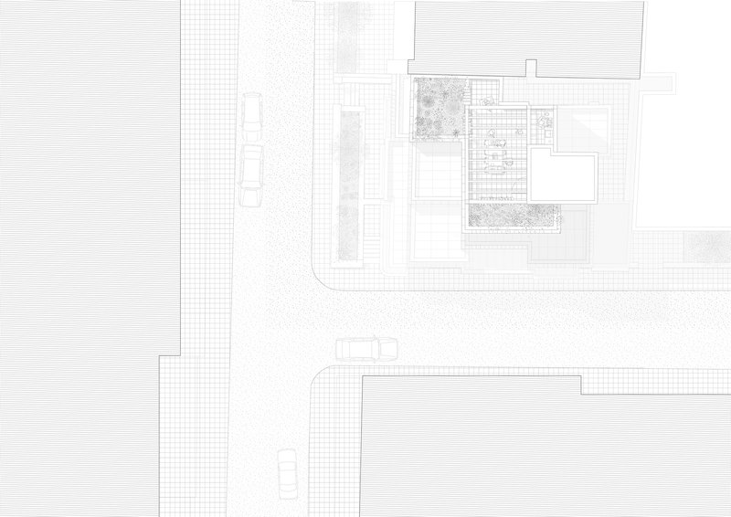 Site plan drawing depicting the building footprint with planted terraces at the street corner