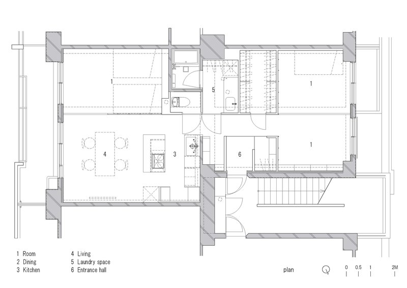Floor plan drawing showing a compact apartment layout with living areas, kitchen, bathroom and two sleeping rooms