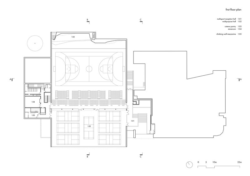 First floor plan drawing showing a gymnasium court with bleacher seating and adjacent support spaces