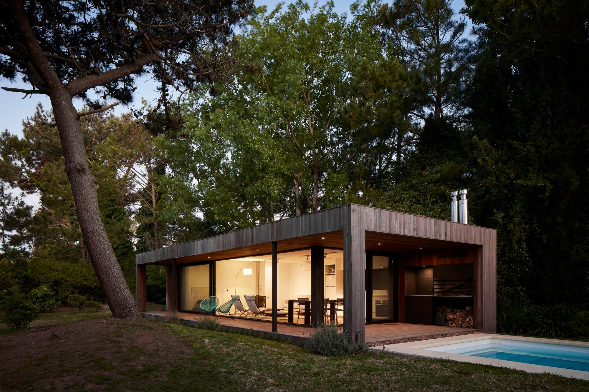 iHouse estudio Tucks a Prefab Timber Pavilion into the Pine Trees of Punta del Este