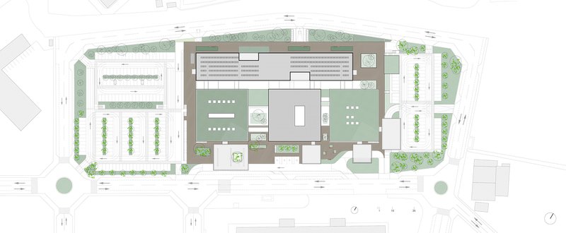 Site plan drawing showing the building complex with courtyards, parking areas and surrounding street trees