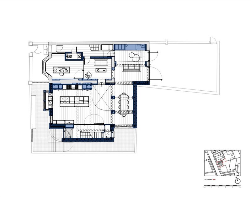 Floor plan drawing showing kitchen, living spaces and staircase with blue accent walls indicated