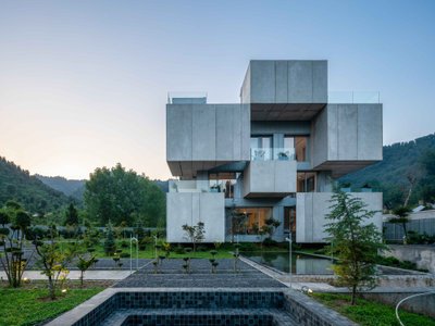 Bood Design Bureau Splits a Gilan Residence in Two to Let the Forest In
