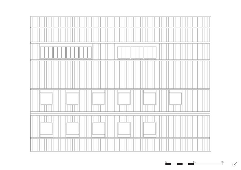 Elevation drawing of a vertical-clad facade with square windows and skylights at the roofline