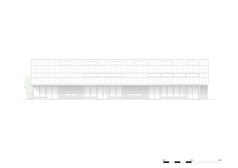 Elevation drawing showing the barn with upper clerestory band and recessed lower openings