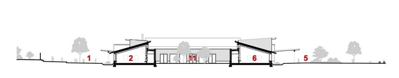 Section drawing showing the varying roof pitches and interior volume relationships across the building