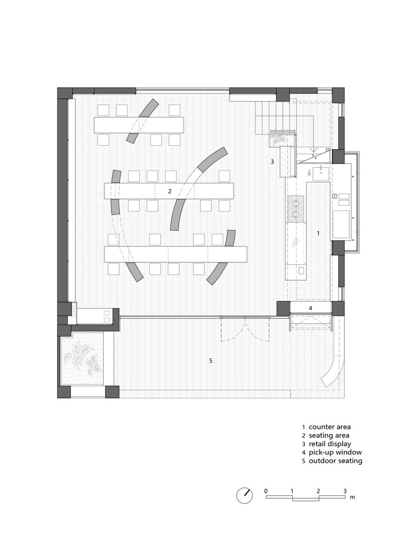 Floor plan drawing showing communal seating area with angled tables and service counter