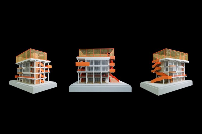 Three views of the physical model with orange external stairs wrapping the structural frame