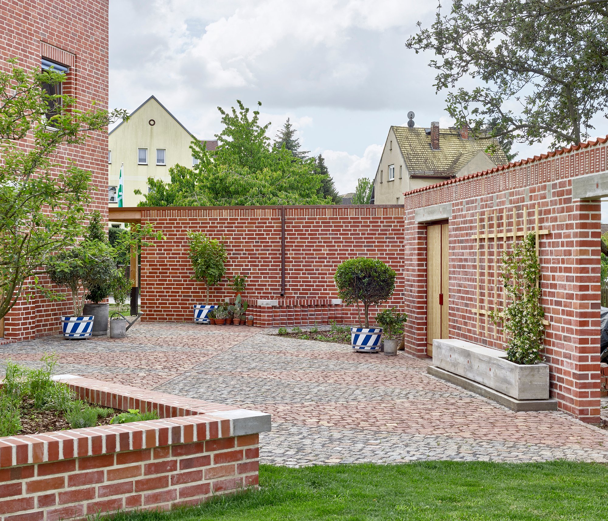Meier Unger Shapes a Village Courtyard Ensemble from Brick in Rural Germany