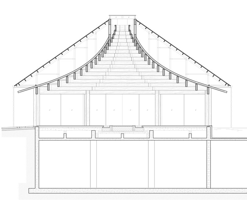 Section drawing showing the sloped roof trusses and column supports over two floor levels