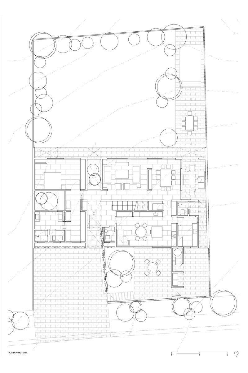 Ground floor plan drawing showing interior rooms and terraces surrounded by circular tree symbols