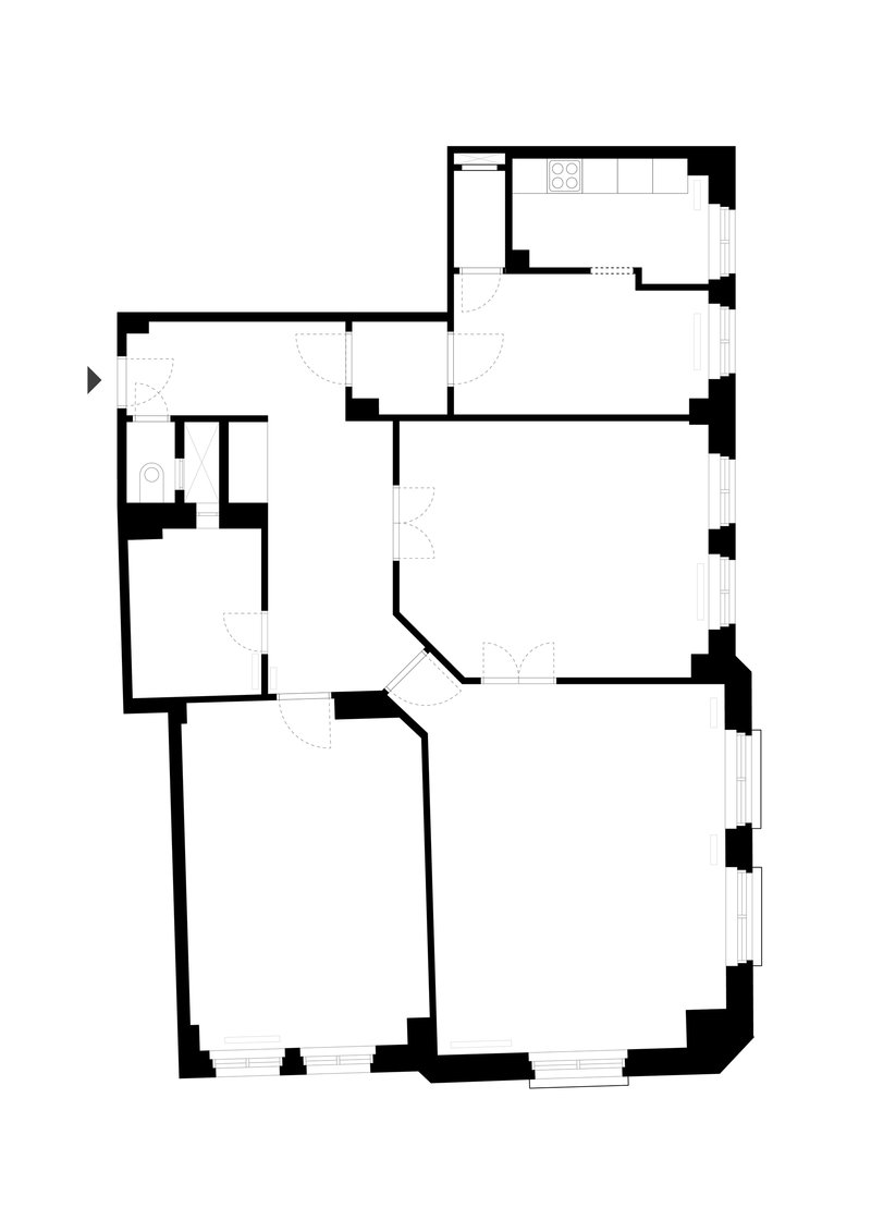 Floor plan drawing showing an L-shaped apartment layout with kitchen and bathroom in upper wing