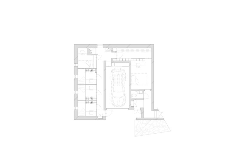 Ground floor plan drawing showing parking spaces, central vault and rear triangular terrace