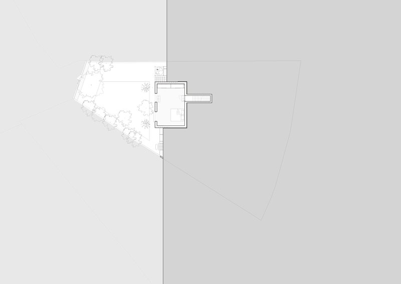 Site plan drawing showing a small rectilinear structure with adjacent garden and planted areas