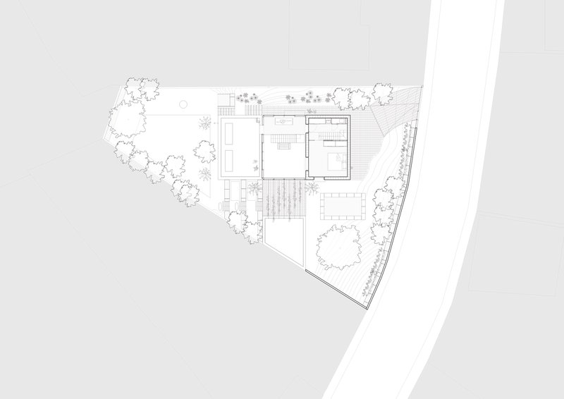 Upper floor plan drawing showing bedrooms and a central staircase with exterior terraces