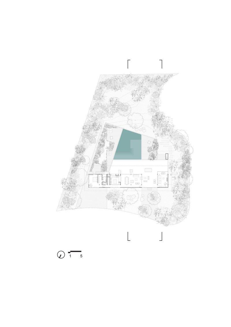 Ground floor plan drawing showing linear living spaces adjacent to a pool and landscaped perimeter