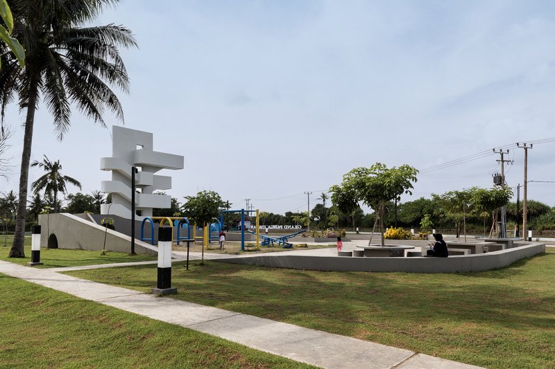 White sculptural observation tower with spiraling cantilevers overlooking the public park and playground