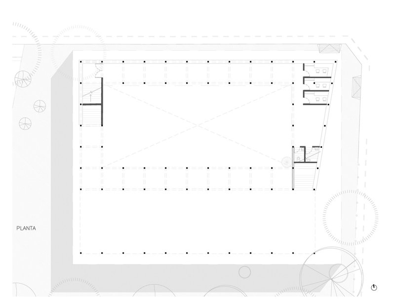 Floor plan drawing showing a rectangular volume with regular column grid and service cores at corners