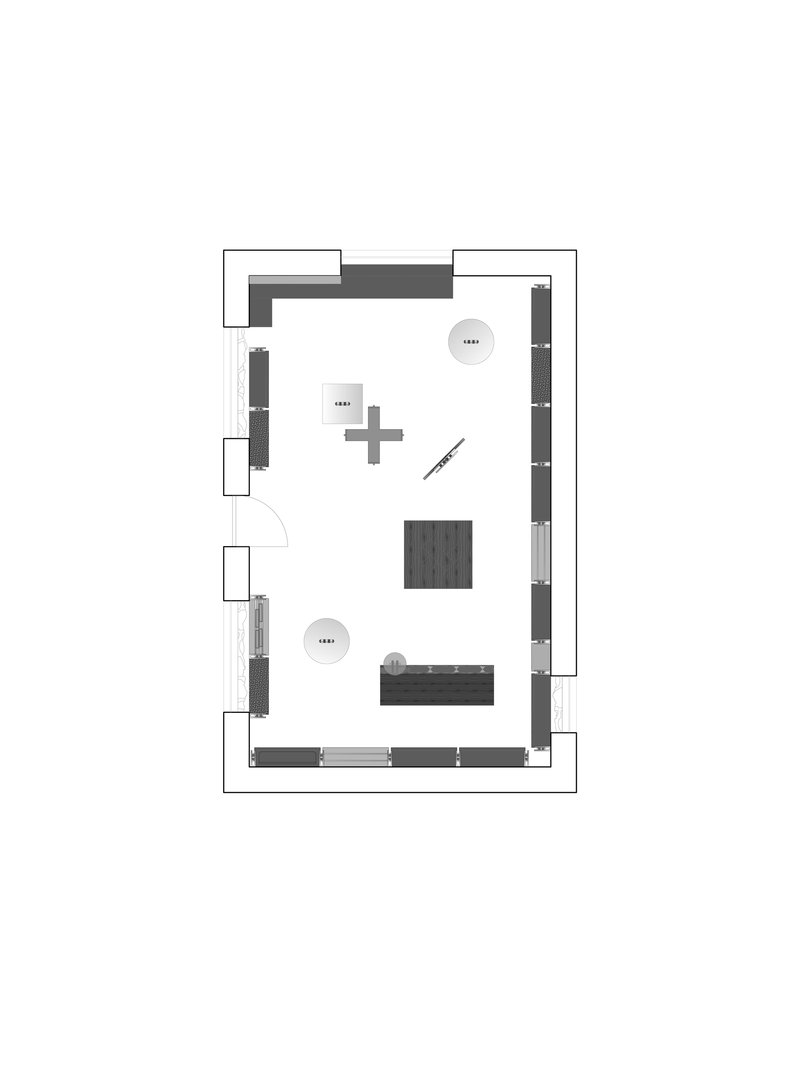 Floor plan drawing showing a rectangular volume with perimeter built-in furnishings and central seating areas