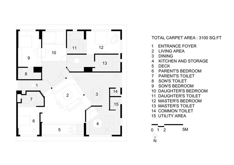 Floor plan drawing showing living areas, four bedrooms, five toilets, and service spaces arranged around central zones